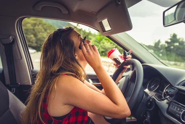 Woman Doing Makeup While Driving