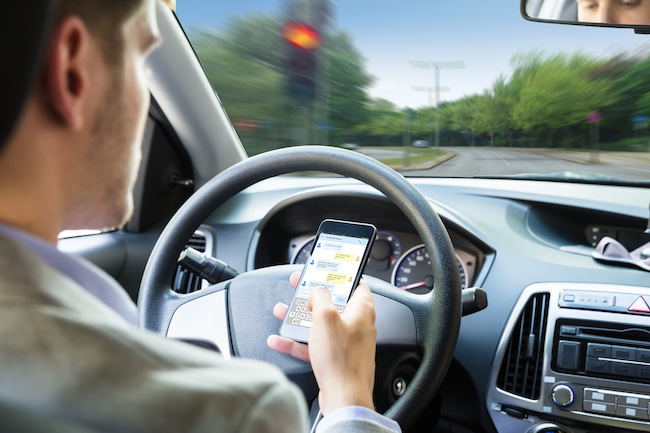 Man Texting and Driving