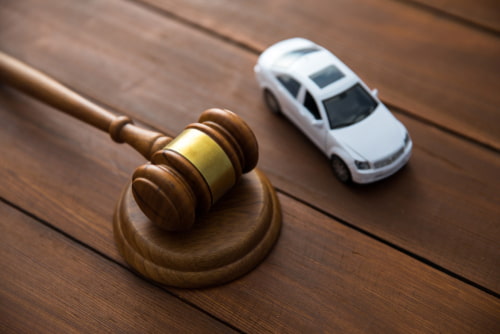 South Carolina Uber accident lawyer desk with judge gavel and toy car
