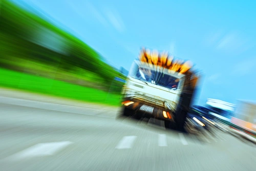 A tractor-trailer truck in motion represents the concept of a commercial truck crash.