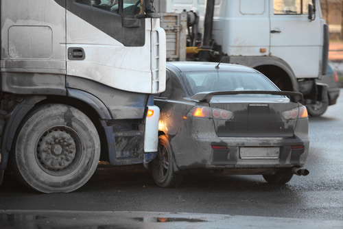 The concept of what to do after a truck accident is shown with a crash scene.
