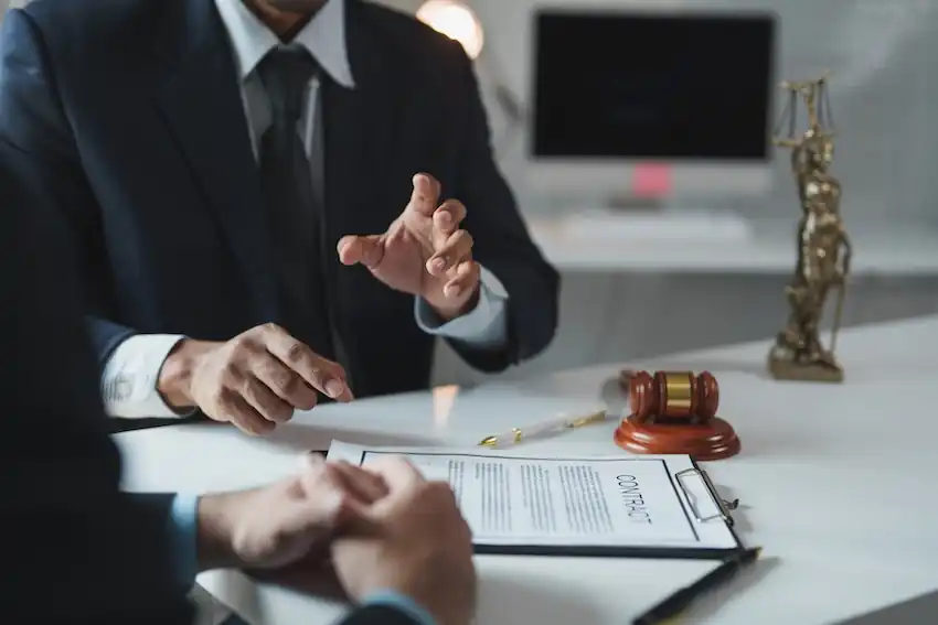 Personal injury lawyer negotiating with an insurance adjuster on behalf of a client