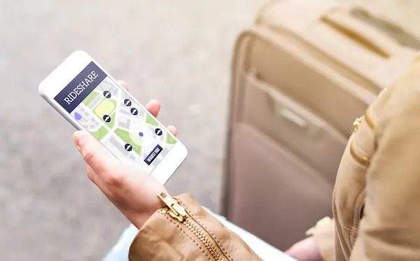 Rideshare app on smartphone representing Uber and Lyft accident claims in Spartanburg